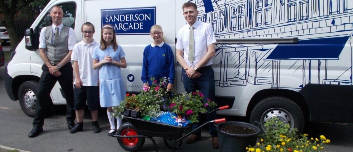 Green fingered youngsters dig in for town's floral displays